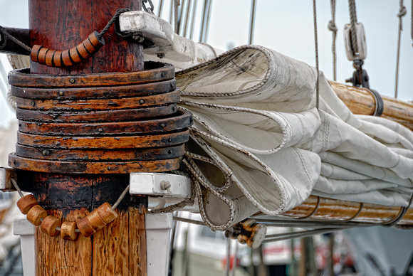 Old Sailboat Sails Furled Wooden Mast