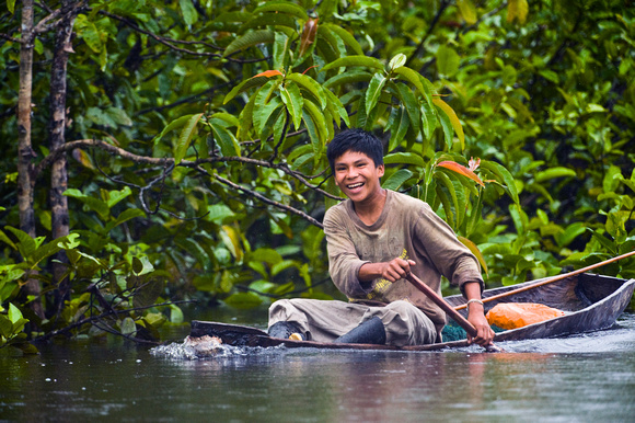 Boy in Canoe Peruvian Amazon