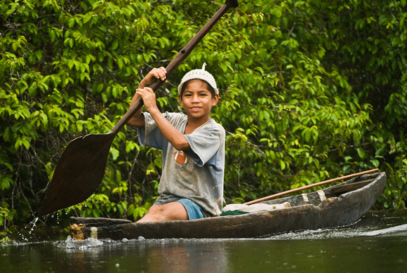 Peruvian Indian Boy in Canoe Amazon